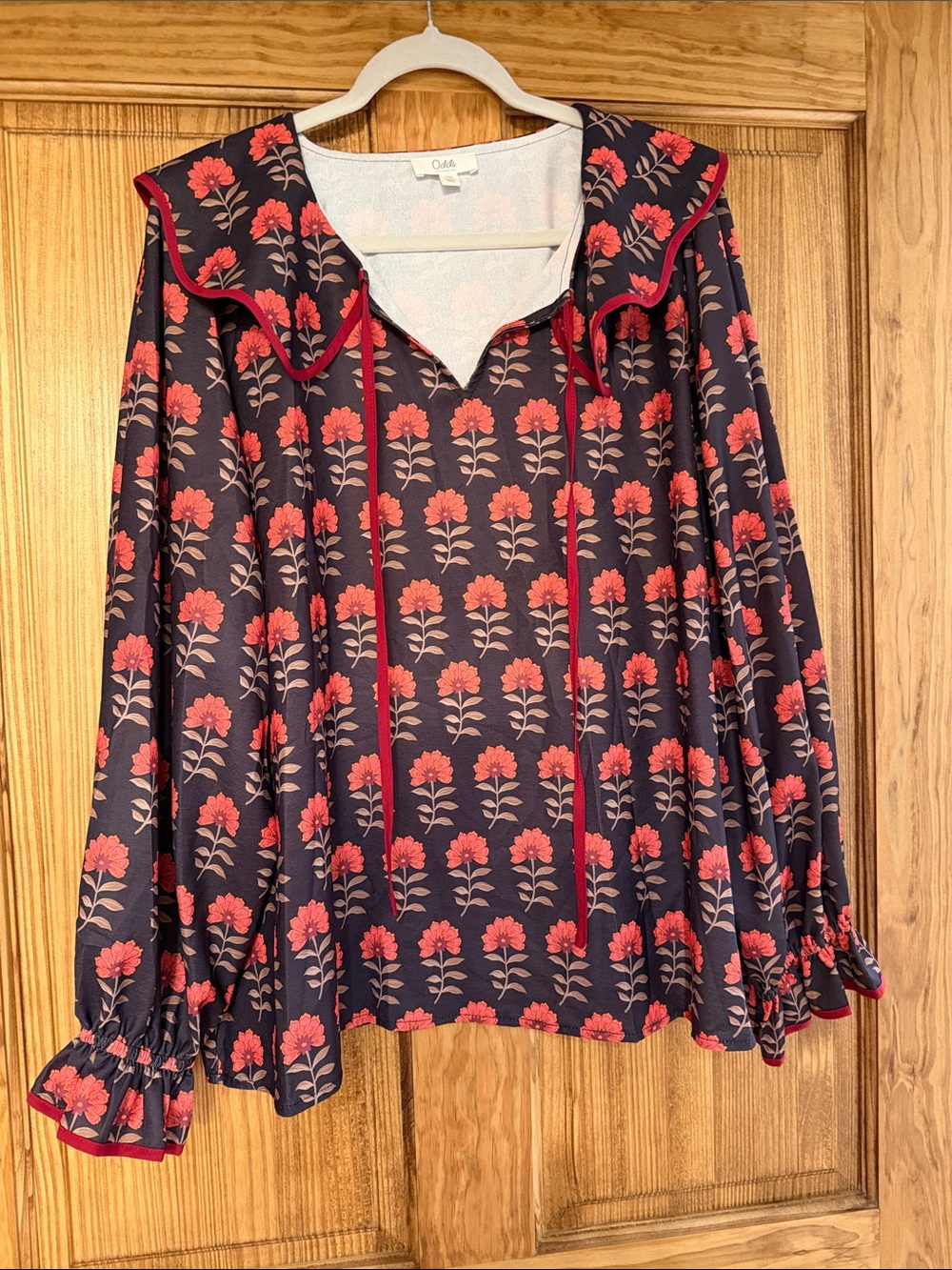 Olivia Navy Blouse with Red Floral Print and Ruffle Collar